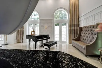 a living room with a piano and a couch at Amazing 3BD Ocean View Condo Beach Service 715 in Miami Beach