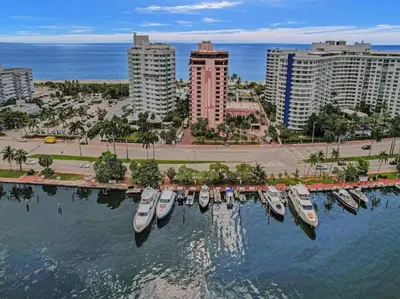 a group of boats docked in the water in a city at Cozy Ocean View Condo Beach Service 1015 in Miami Beach