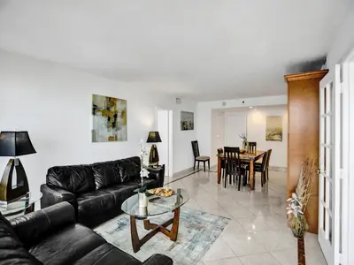 a living room with a couch and a table at Perfect Ocean View Condo Beach Service 1109 in Miami Beach