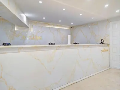 a bar in a room with a marble wall at Ocean View Condo Beach Service and Pool 618 in Miami Beach