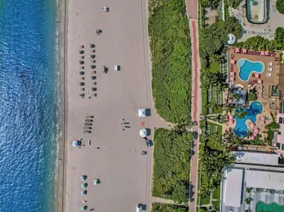 an overhead view of a beach next to the water at Ocean View Condo Beach Service and Pool 618 in Miami Beach