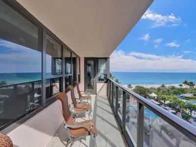 a balcony with chairs and a view of the ocean at Spacious Ocean View Condo Beach Service 803 in Miami Beach
