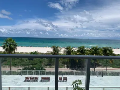 a view of the beach from the balcony of a resort at Pavilion in Miami Beach