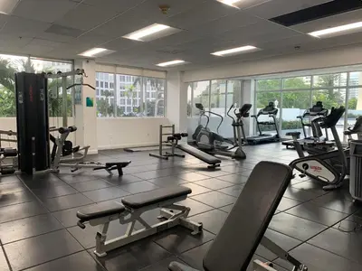 a gym with several treadmills and exercise bikes at Pavilion in Miami Beach