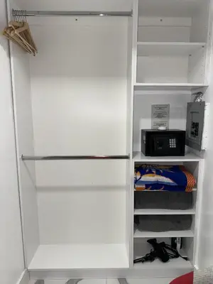 a white refrigerator with its door open with a microwave at Luna y Sol Calle 8 in Miami