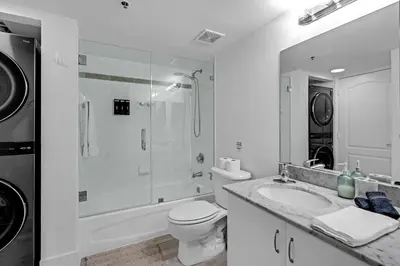 a bathroom with a toilet and a shower and a sink at LUX 2B/2B Brickell - Free Parking in Miami