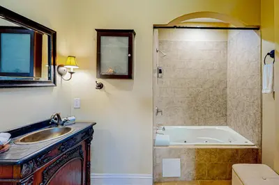 a bathroom with a tub and a sink and a shower at Go with the Flow in Hollywood