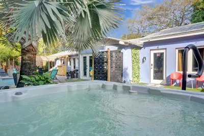 a swimming pool in the backyard of a house at Kiki 2 - Men's Clothing optional Guest Houses in Fort Lauderdale