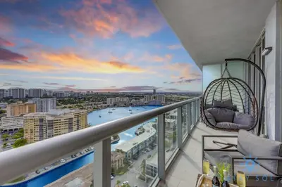 a balcony with a swing and a view of a city at Infinite View Balcony Gym Amaizing Pool in Hallandale Beach