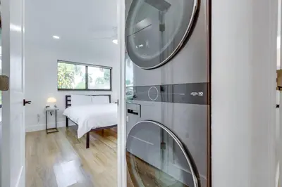 a bathroom with a washing machine in a room at Chic Florida Retreat with Pool, Patio and Gas Grill! in Fort Lauderdale
