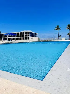 a large swimming pool in front of a building at Castle 1118 Studio BayView Direct Beach Access, Tennis, Pool, Restaurants, Free Parking in Miami Beach