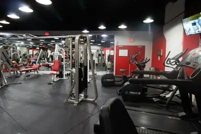 a gym with several treadmills and machines at Castle 1120 Bayview Studio, Beach access, Pool, Tennis, Free parking in Miami Beach