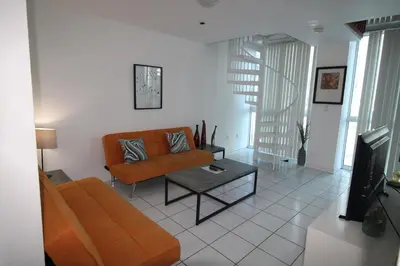 a living room with a couch and a table at Castle B6 in Miami Beach