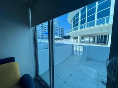 a view of a building with a view of a pool at Castle BTH2 Stunning Oceanfront Townhouse, Private Beach Access, Private Pool Access, Tennis and Free Parking! in Miami Beach