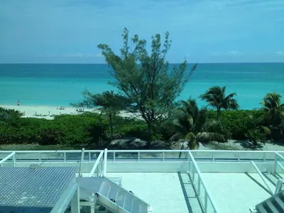 a view of the beach from the balcony of a resort at Castle M4 Beachfront Balcony Loft, FREE Parking, Pool, Tennis, Beach Access in Miami Beach