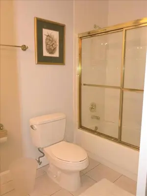 a bathroom with a white toilet and a shower at Castle PH12 Spacious Bay View Penthouse, Pool, Tennis, Free Parking in Miami Beach