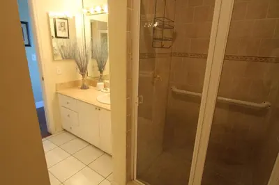 a bathroom with a shower with a glass door at Castle PH15 Spacious Penthouse with Balcony, Beach Access, Pool, Tennis, Free Parking in Miami Beach