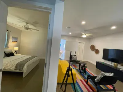 a bedroom with a bed and a flat screen tv at Best location Miami Brickell 3 bedroom Home in Miami
