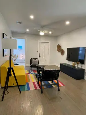 a living room with a table and chairs and a tv at Best location Miami Brickell 3 bedroom Home in Miami