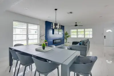 a dining room with a table and chairs at Luxe Miami Home Outdoor Kitchen, Gas Grill! in Miami Gardens