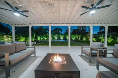 a patio with a fire pit in the middle at New Tropical Oasis Retreat in Miami in Miami