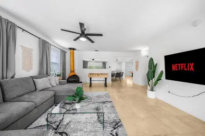 a living room with a couch and a ceiling fan at New Tropical Oasis Retreat in Miami in Miami