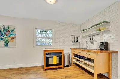a kitchen with a wooden counter and a counter top at Casa Del Rio 4 Bed 2 Bath Next to River 1826 in Miami