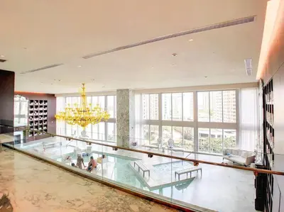 a large room with a glass floor and a chandelier at ICON W BRICKELL BY IMD MIAMI Splendid Ocean View 2BR 1BA in Miami