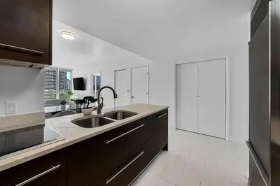 a kitchen with two sinks and a large window at ICON W BRICKELL BY IMD MIAMI Splendid Ocean View 2BR 1BA in Miami