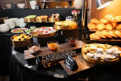 a buffet of bread and pastries on a table at Gale Miami Hotel & Residences in Miami