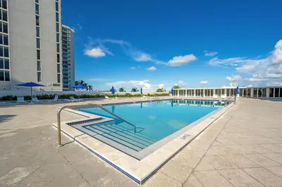a swimming pool in the middle of a building at Pavilion Residences on the Beach in Miami Beach