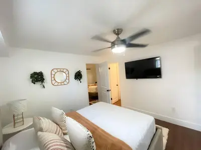 a bedroom with a bed and a ceiling fan at New Miami Boutique, by Calle Ocho and South Beach! in Miami