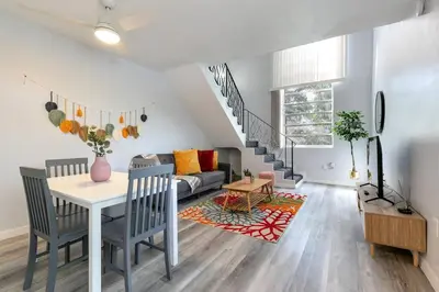 a living room with a table and a couch at Central 1b apt Next to Airport Virg 12 in Miami