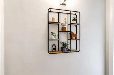a shelf on a wall with potted plants on it at Spacious 2 BR near Miami Airport Virg 5 in Miami