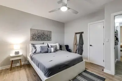 a bedroom with a bed and a ceiling fan at Roomy 2 BR near Miami Airport Virg 7 in Miami