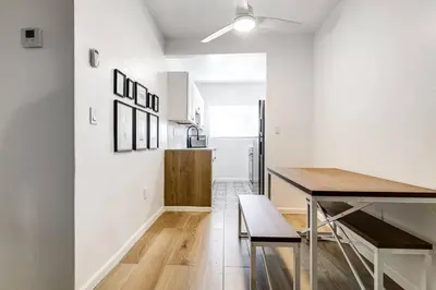 a kitchen and dining room with a table and chairs at Miami Airport 2-bedroom unit with speedy Wi-Fi Virg8 in Miami