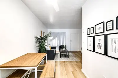a living room with a table and a couch at Miami Airport 2-bedroom unit with speedy Wi-Fi Virg8 in Miami