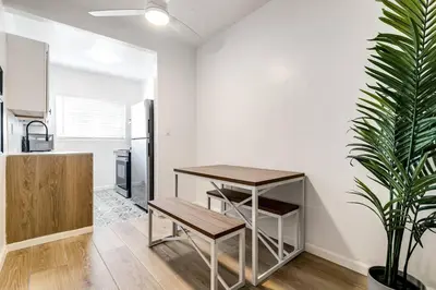 a kitchen with a table and a potted plant at Miami Airport 2-bedroom unit with speedy Wi-Fi Virg8 in Miami