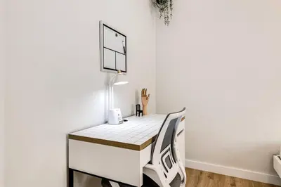 a room with a desk with a basketball hoop on the wall at Stylish 2BR central Fast Wi fi virg2 in Miami