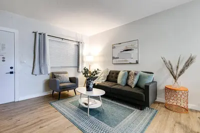 a living room with a couch and a table at Mia Springs 2BR wi-fi Virg 3 in Miami