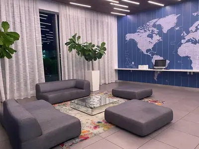 a living room with a map of the world on the wall at Oceanfront Elegance, Full Kitchen & Miami Beach Charm -A in Hallandale Beach