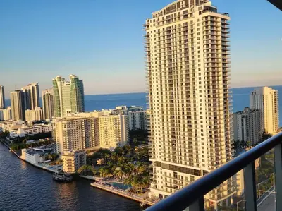 a view of a city skyline with a tall building at Luxury Beach Apartment Designer Touches & Sea Views -A in Hallandale Beach