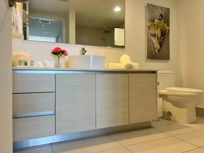 a bathroom with a sink and a toilet at Seaside Style in Miami, Modern Comfort & Full Kitchen -A in Hallandale Beach