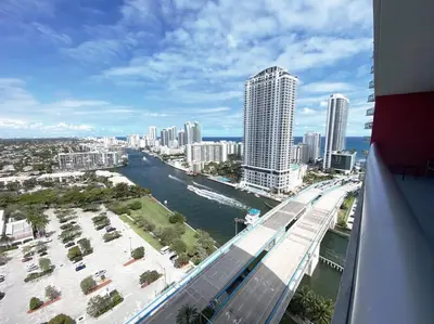 a view of a city with a river and buildings at Chic Miami Beach Stay, Comfort, Style & Sea Views -A in Hallandale Beach