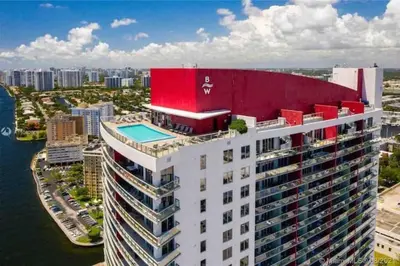 an aerial view of a building with a swimming pool at Feel the Miami Vibe , Cozy & Stylish Studio Stay in Hallandale Beach