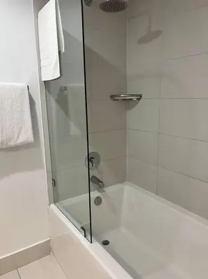 a shower with a glass door in a bathroom at Make Yourself at Home , Inviting Studio in Miami in Hallandale Beach