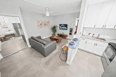 a living room with a couch and a table at Holiday Park Apartments by Lowkl in Fort Lauderdale