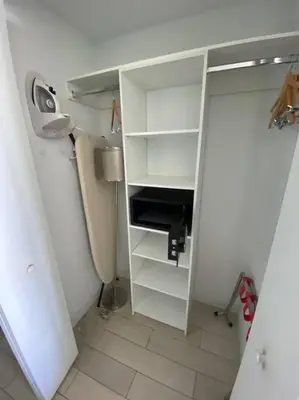 a white closet with a sink and a lamp at Incredible Miami Studio with 2 full Beds, 1 Bath, Stylish Stay in Hallandale Beach