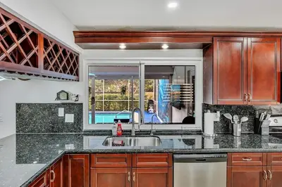a kitchen with a sink and a window at Vacation Villa W Heated Pool Beach & Casino in Hollywood