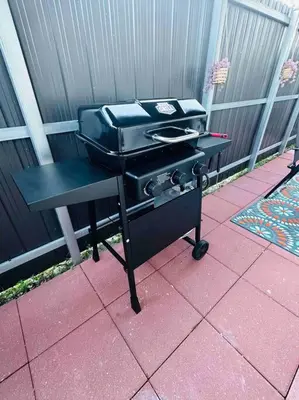 a grill sitting on top of a patio at Coral Gables Miami Studio near Airport and Beaches in Miami